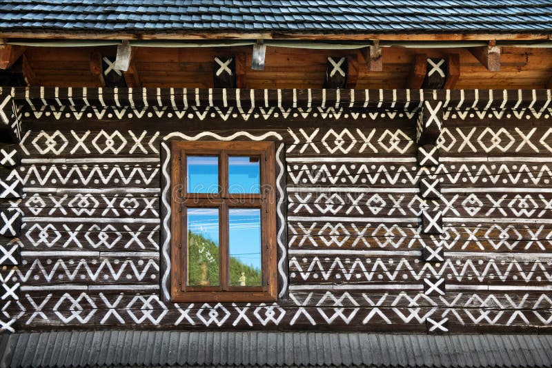 Painted decorations on wall of log house in Cicmany, Slovakia