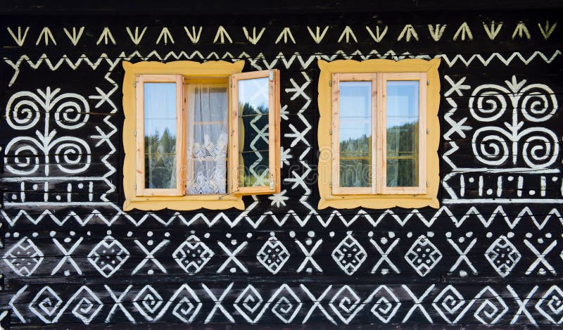 Painted decorations on wall of log house in Cicmany, Slovakia