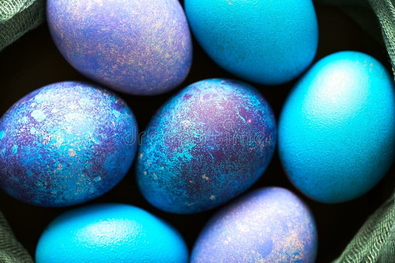 Painted Easter Eggs in Blue, Green and Purple Closeup Stock Photo