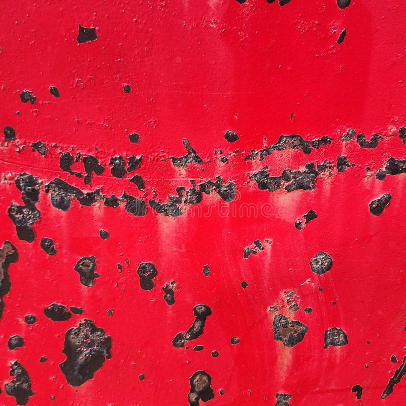 Painted metal red with rust spots stock photography