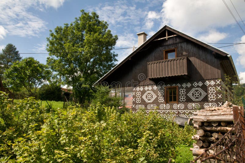 Painted Wooden House with wooden fence