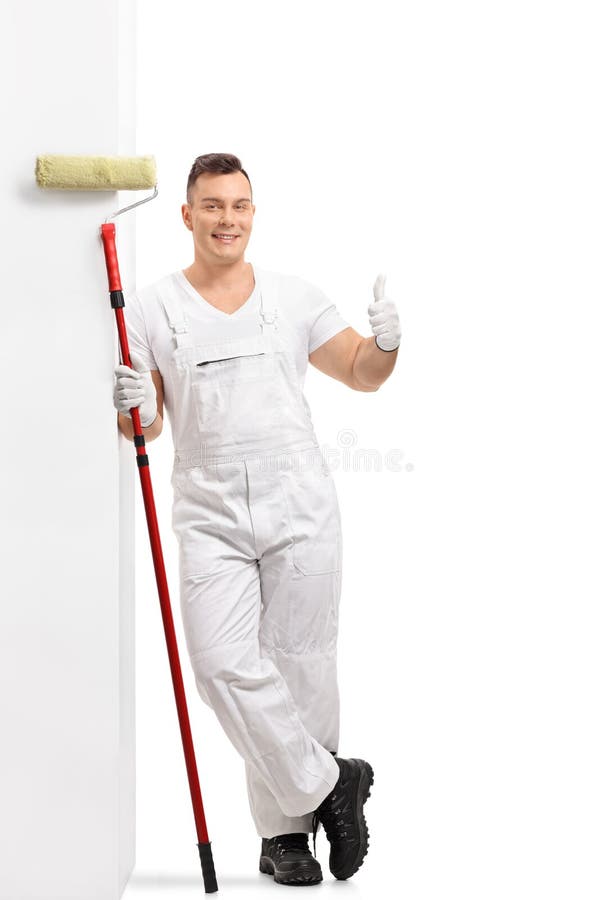 Painter Leaning Against a Wall and Making a Thumb Up Gesture Stock