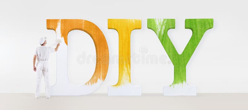 Painter man with paint brush, painting a text diy on white blank royalty free stock photo Painter man with paint brush, painting a text diy on white blank royalty free stock photo