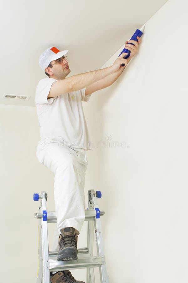 Painter repairing cracks stock photography