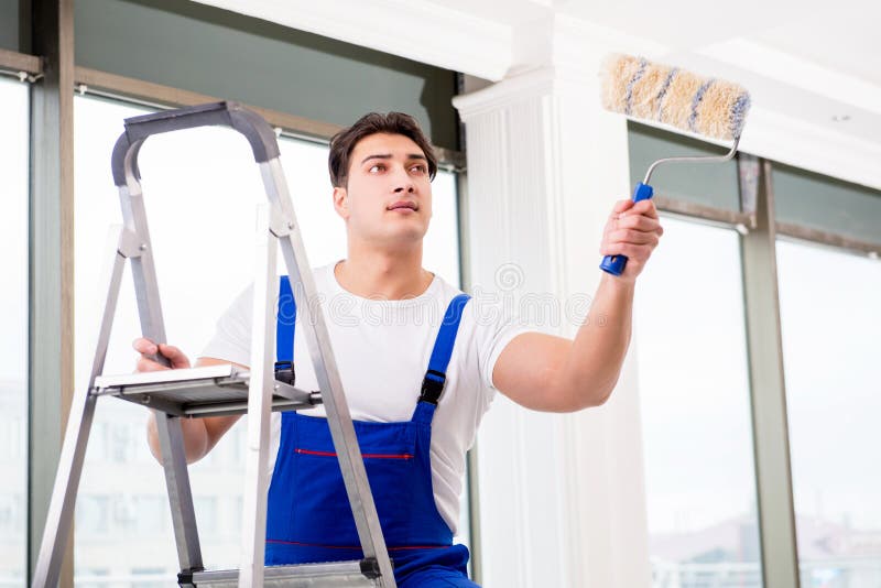 The Painter Repairman Working at Construction Site Stock Photo - Image