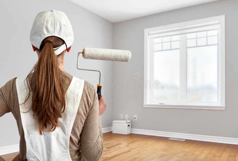 Painter woman with painting roller