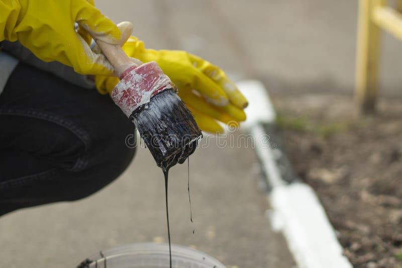 Painting with Black Paint. Paint on a Molar Brush. the Work of a