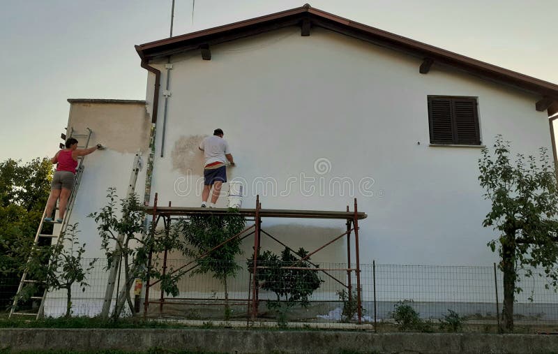 Painting a facade of a house for renovation