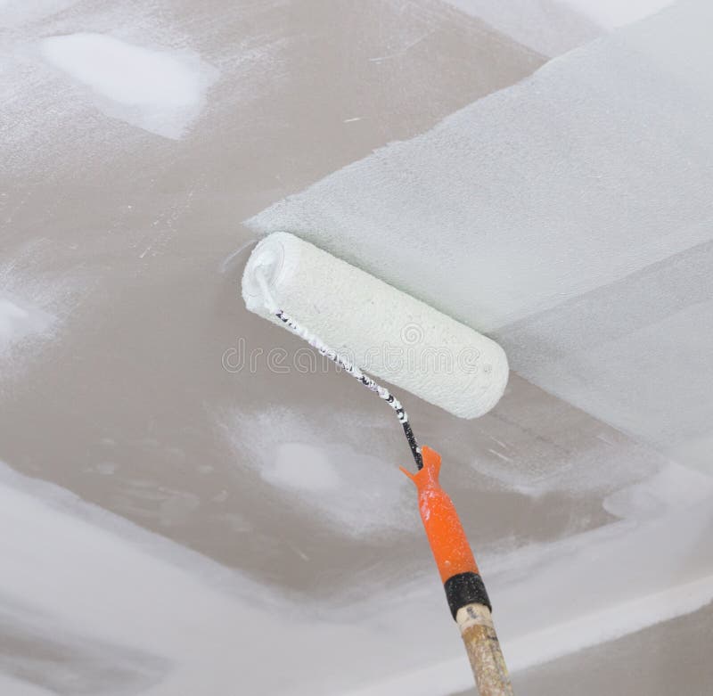 Painting A Gypsum Plaster Ceiling With Paint Roller. Stock Image