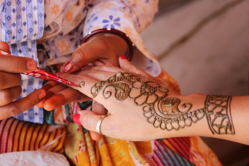 Painting Hand With Henna In Flower Design Royalty Free Stock Image