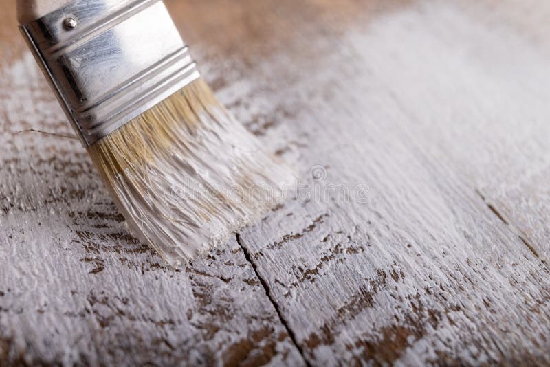Painting Raw Wood with White Paint. Minor Painting Work at Home Stock