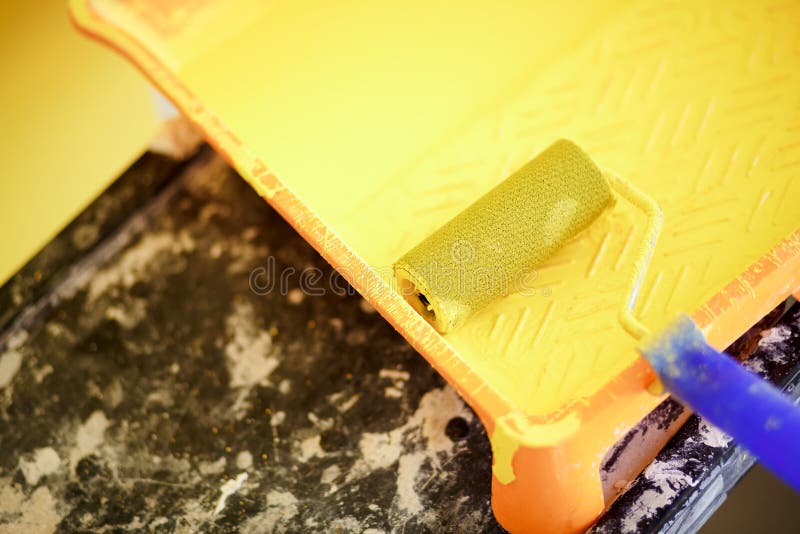 Painting Tools, Yellow Roller in Tray with Acrylic Paint. Stock Photo
