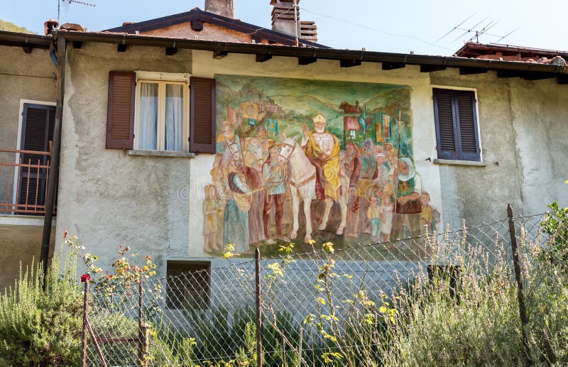 Painting on the wall of a house at painters village Arcumeggia in province of Varese, Italy. royalty free stock photos Painting on the wall of a house at painters village Arcumeggia in province of Varese, Italy. royalty free stock photos