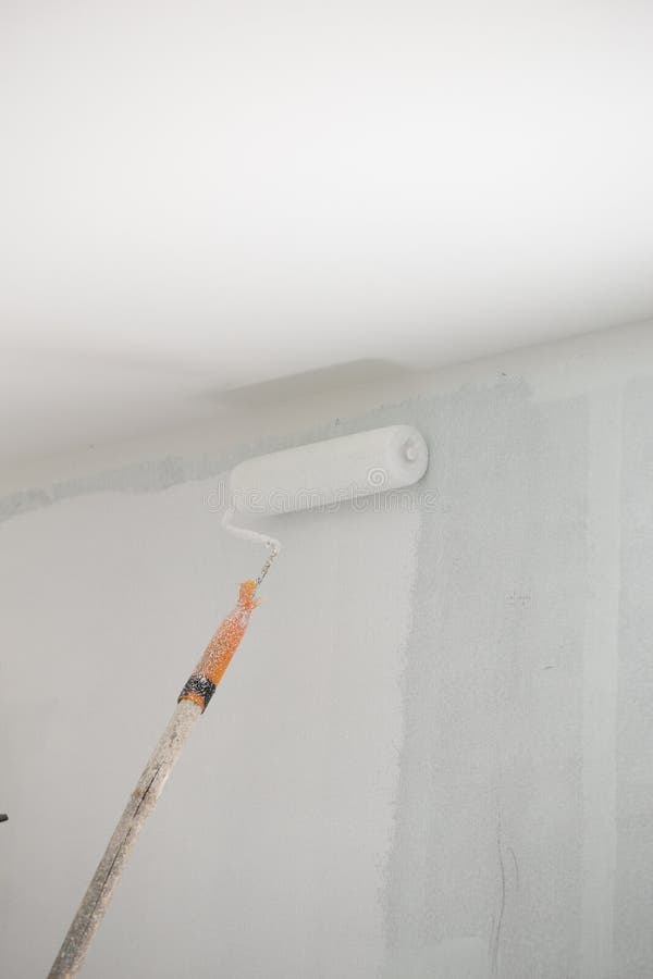 Painting a Gypsum Plaster Ceiling with Roller Stock Photo Image of occupation, house 70536662