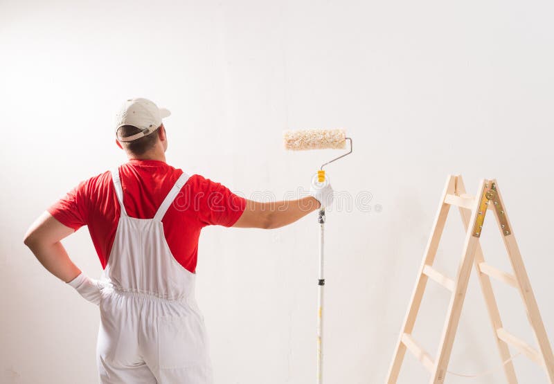 Painting Wall with Roller stock image. Image of interior 58457607