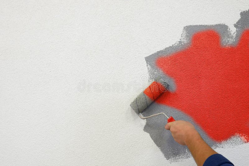 Painting Walls with a Roller in His Left Hand Stock Image Image of