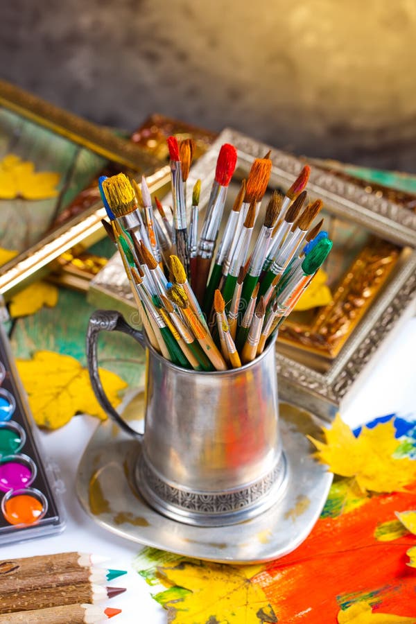 Paints and brushes stock images