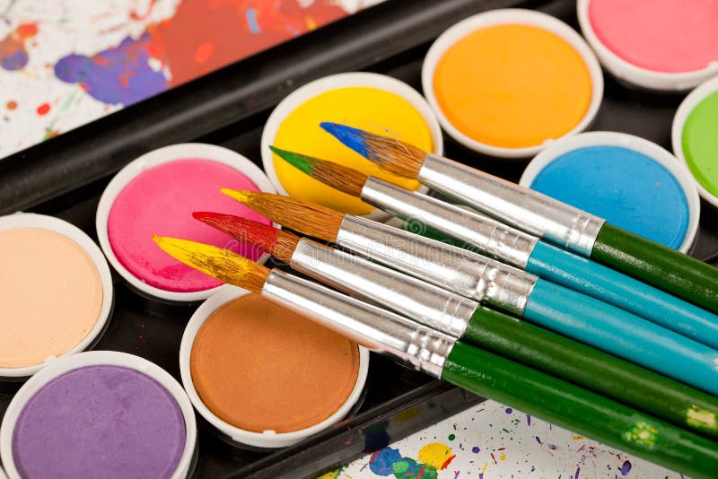 Paints and brushes royalty free stock photos
