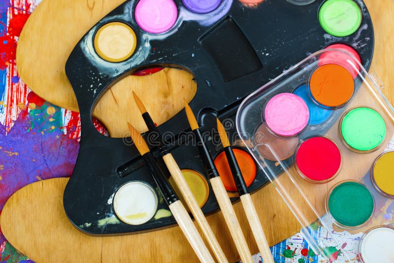 Paints and brushes royalty free stock photos