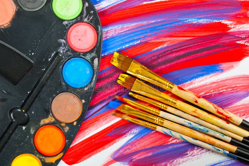 Paints and brushes stock photography