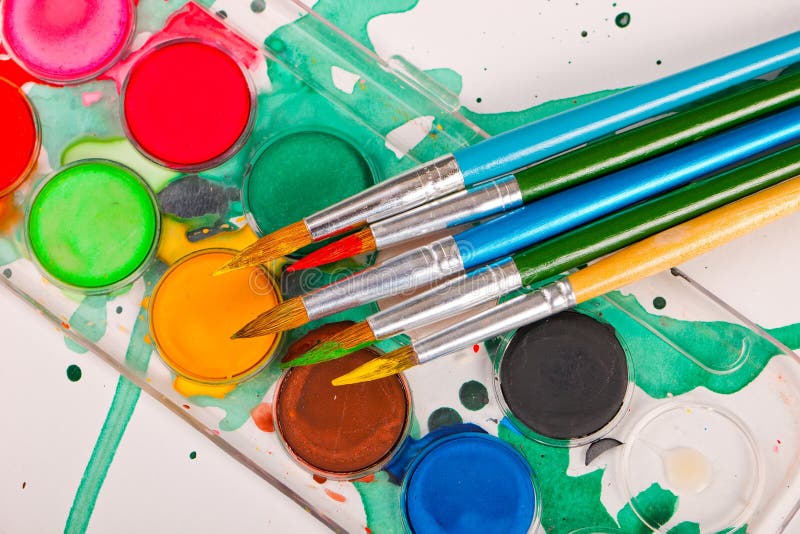 Paints and brushes stock photography