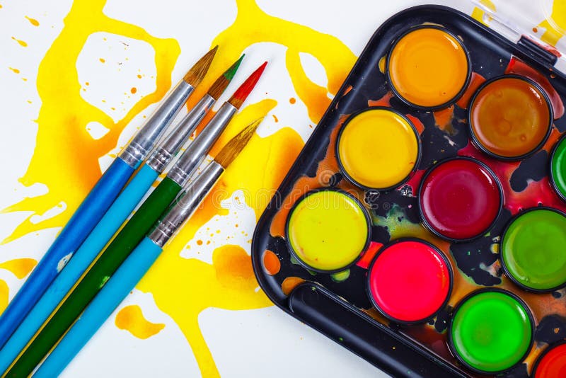 Paints and brushes stock images