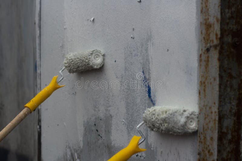 Paints the Graffiti with a Roller Stock Image Image of holding, blue