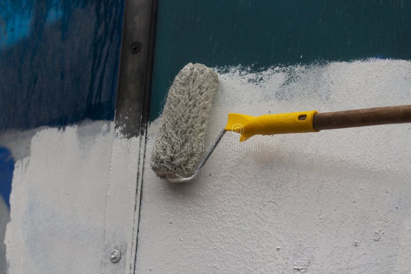 Paints the Graffiti with a Roller Stock Photo Image of obsolete, hair