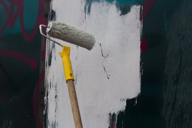 Paints the Graffiti with a Roller Stock Image Image of color, brush
