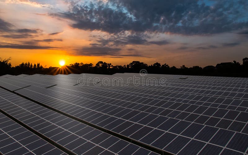 Solar panels power plant with warm sunrise and cloudy sky. Solar panels power plant with warm sunrise and cloudy sky