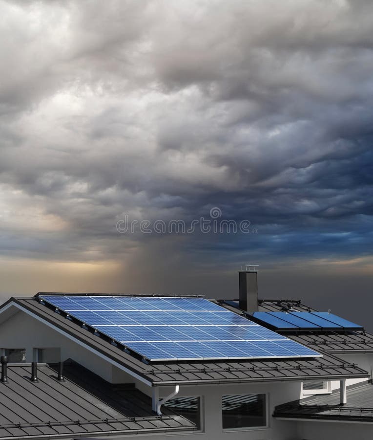 Solar panel system on house roof, stormy rain clouds approaching. Solar panel system on house roof, stormy rain clouds approaching