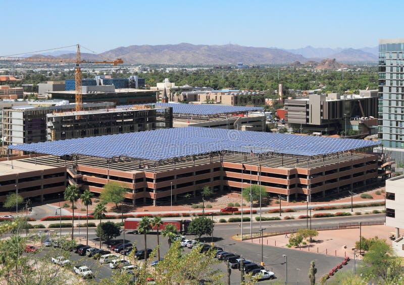 Solar panels provide shade for parking garages of Arizona State University in Tempe. The panels also utilize the 296 sunny days per year of Phoenix Sun Valley to produce energy. - more information: - South Mountain Range in the background. Solar panels provide shade for parking garages of Arizona State University in Tempe. The panels also utilize the 296 sunny days per year of Phoenix Sun Valley to produce energy. - more information: - South Mountain Range in the background