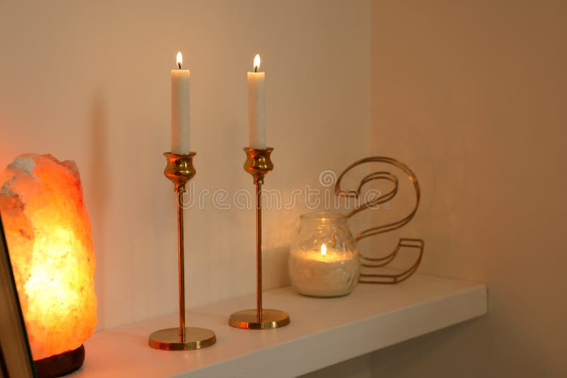 Pair of Beautiful Candlesticks, Scented Candle and Salt Lamp on White