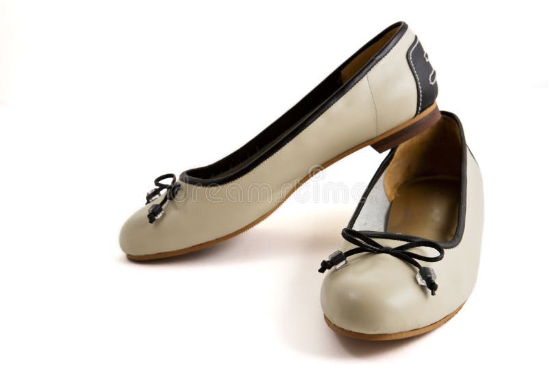 Pair of beige female shoes with black bow