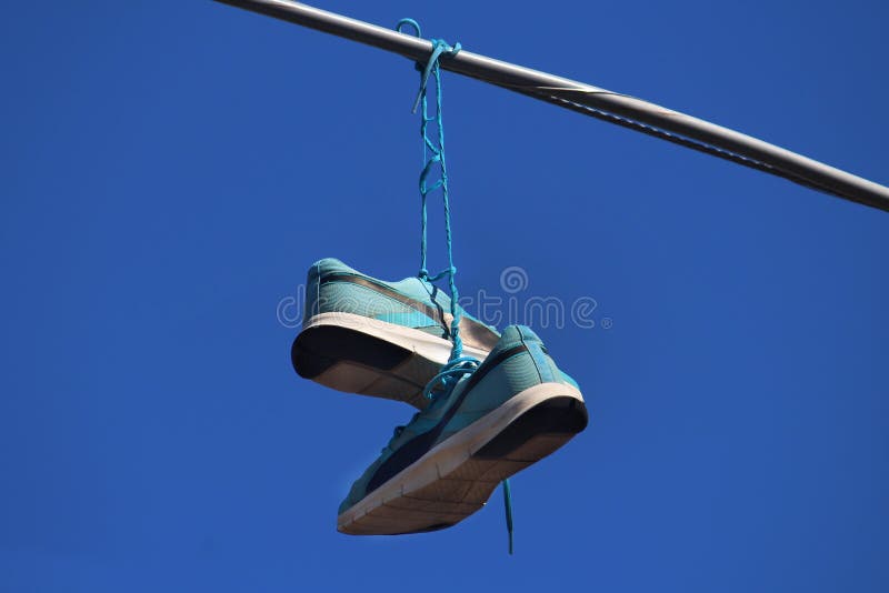 Pair Blue Runners Hanging from Power Lines Stock Photo - Image of gang ...