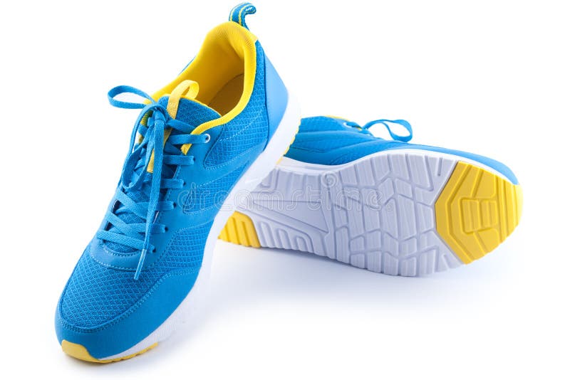 Pair of Sport Shoes on a White Wooden Wall Stock Photo Image of