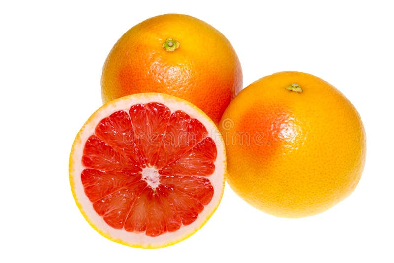 A pair of bright orange grapefruits isolated on a white background. A whole and a cut in half grapefruit with a juicy texture