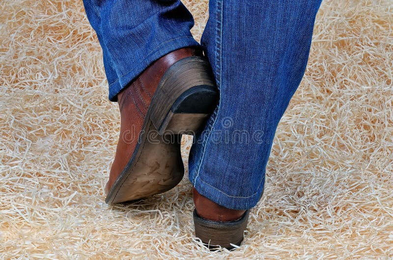 Pair of Legs in Cowboy Boots and Jeans on Straw Stock Photo - Image of ...