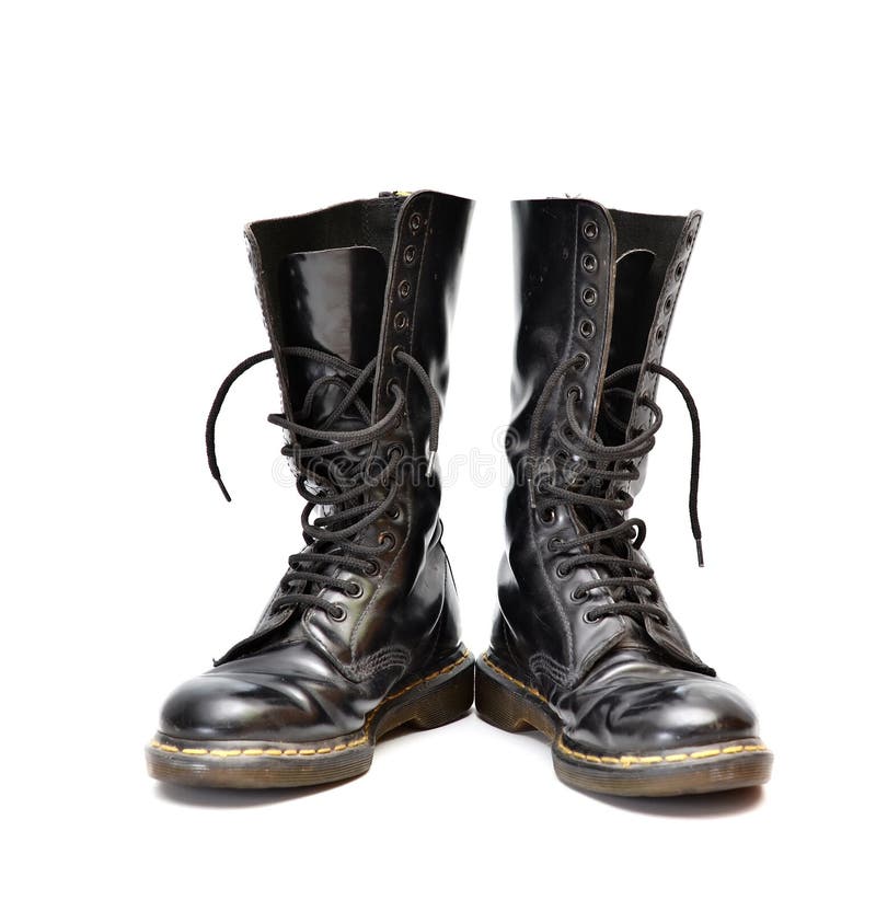 Pair of mid-calf 14 eyelet black lace-up boots stock photos Pair of mid-calf 14 eyelet black lace-up boots stock photos