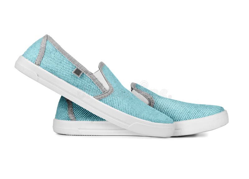 Pair of new light sneakers on a white background stock photos Pair of new light sneakers on a white background stock photos