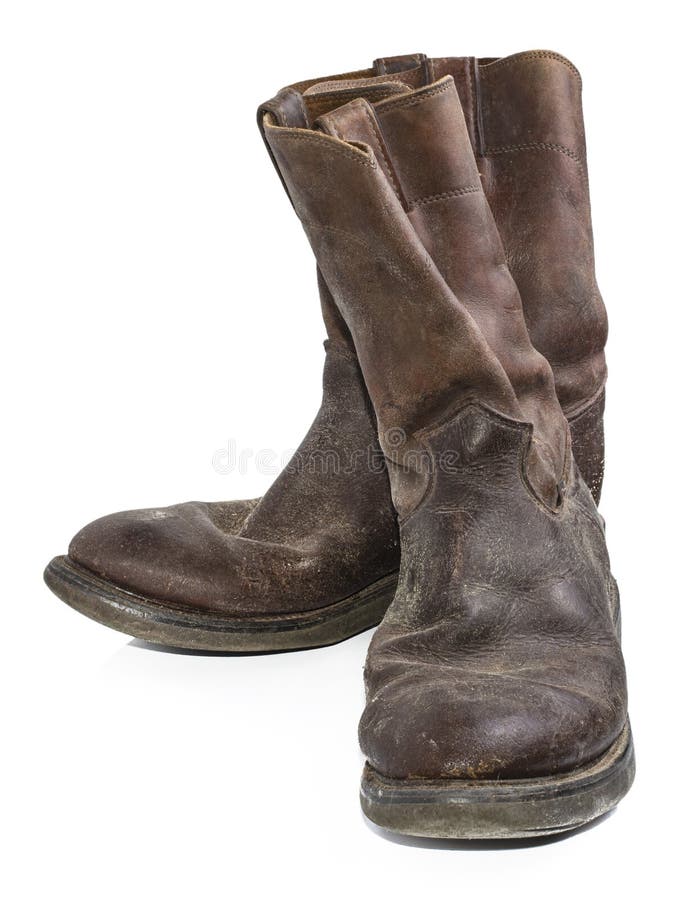 A Pair of Old, Dirty, Brown Cowboy Boots that are Separated Stock Photo ...