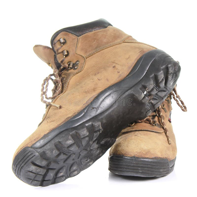 Pair of old yellow working boots Isolated on white background stock photos Pair of old yellow working boots Isolated on white background stock photos