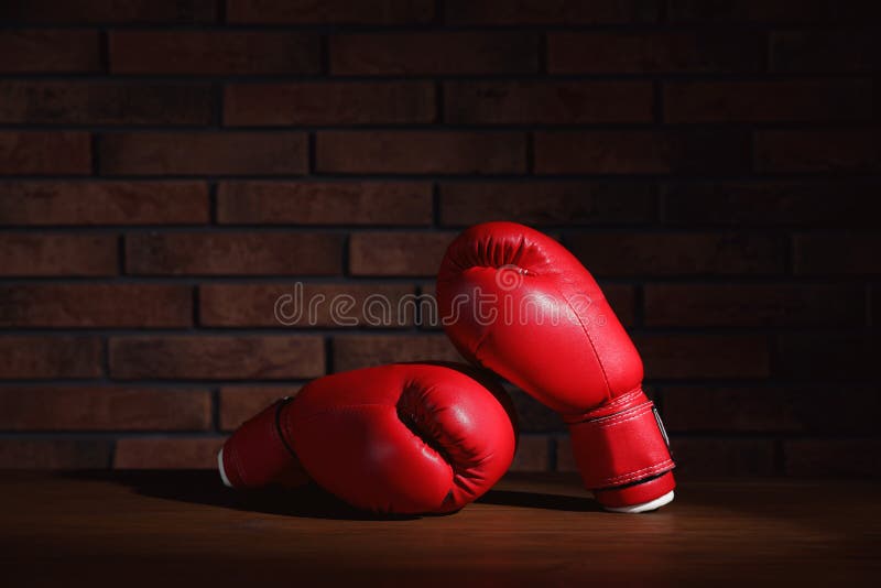 Pair of Red Boxing Gloves on Wooden Table Near Brick Wall Stock Image - Image of object, background: 226806127 Pair of Red Boxing Gloves on Wooden Table Near Brick Wall Stock Image - Image of object, background: 226806127