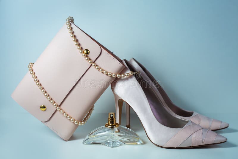 Fashion and Beauty Concept. Shoes with Handbag and Perfume Stock Photo ...