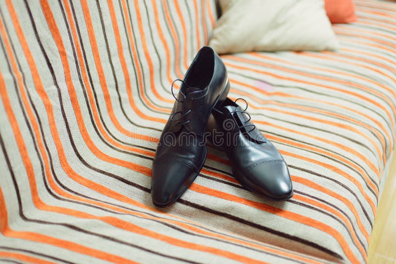 Pair of Shoes on Bed stock photo. Image of shoelace, groom 48219248
