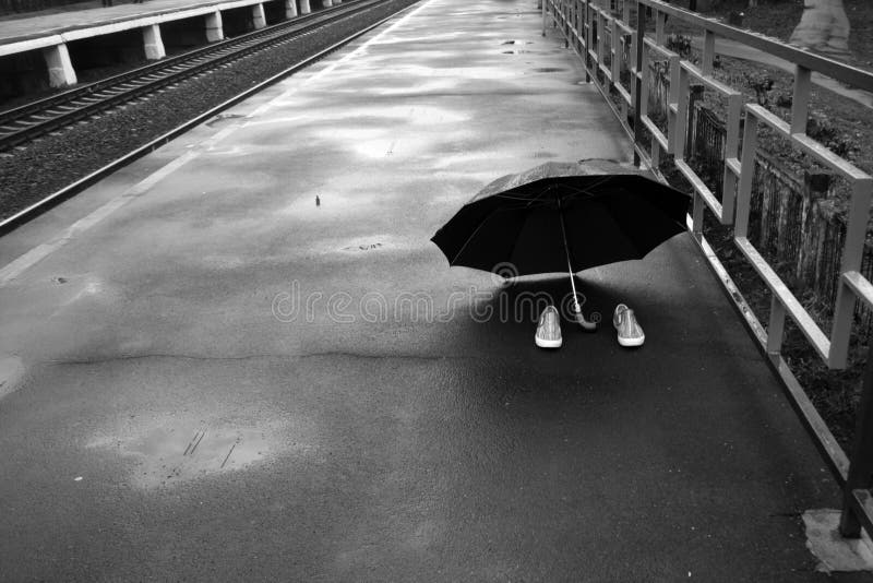 Pair of Shoes and an Umbrella Stock Photo Image of railroad, sportive