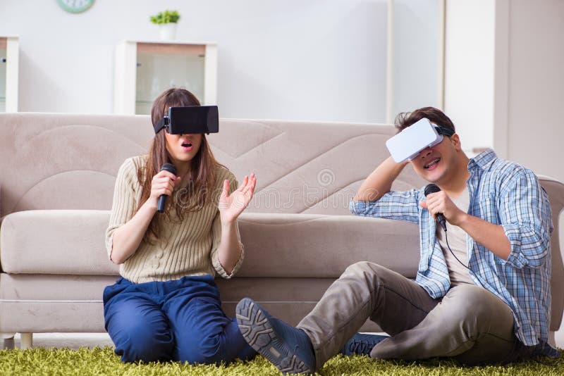 The Pair Singing Karaoke with Virtual Reality Glasses Stock Photo