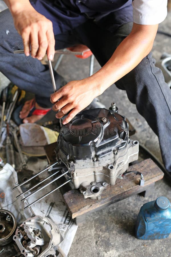 A Pair of Technician Hand Fixing the Motorcycle Stock Image Image of