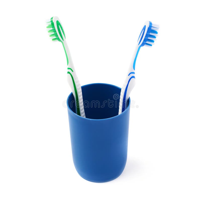 Pair of Toothbrushes in Blue Plastic Cup Isolated Over White Background