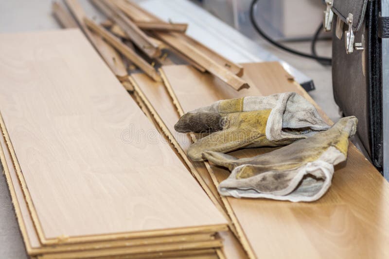 Pair of used gloves lying on removed laminate royalty free stock images Pair of used gloves lying on removed laminate royalty free stock images